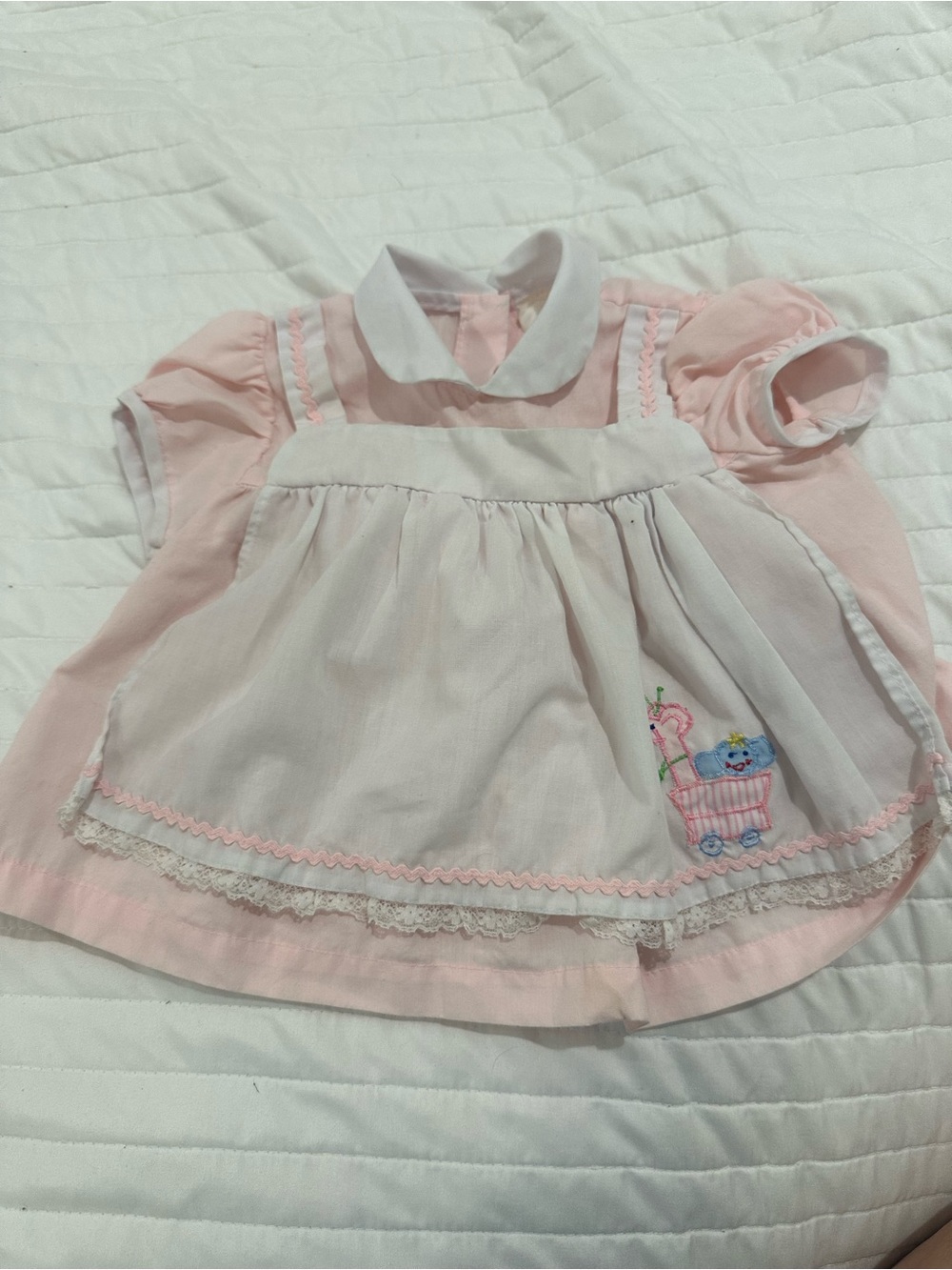 Baby Pink Dress with White Pinafore and Embroidered Cart